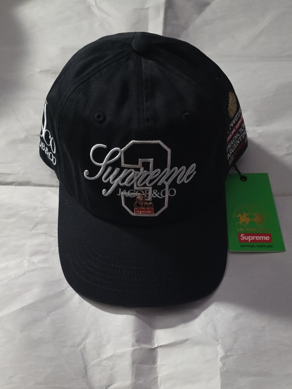 Brand New With Tags Supreme Black Baseball Cap with White Embroidered Script.